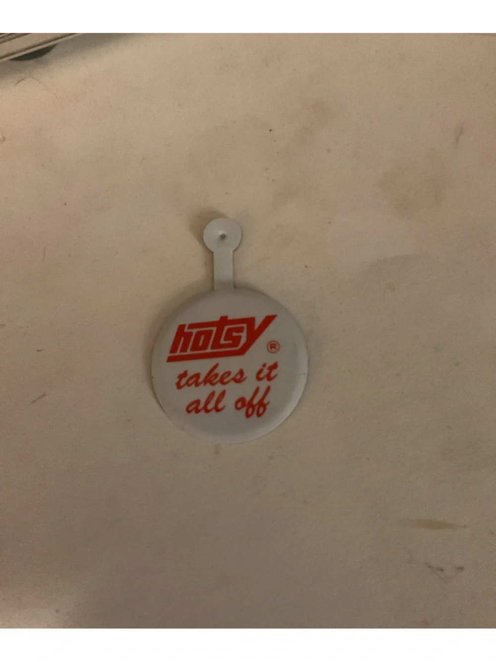 Vintage Hotsy Takes It All Off Folding Button
